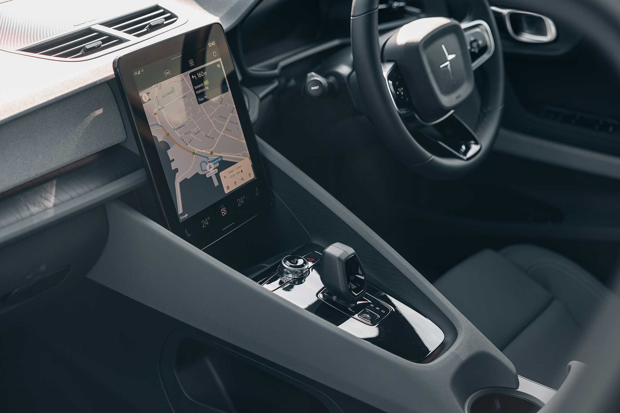 Driving cabin in Polestar 2 with a screen showing map